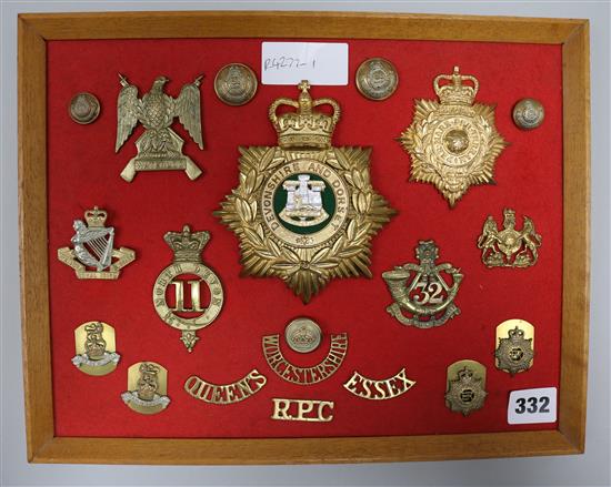 A board of Military cap badges and shoulder titles